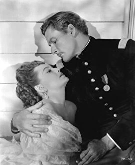 Classic Portraits Collection: Errol Flynn and Olivia De Havilland in Raoul Walshs They Died With Their Boots On (1941)